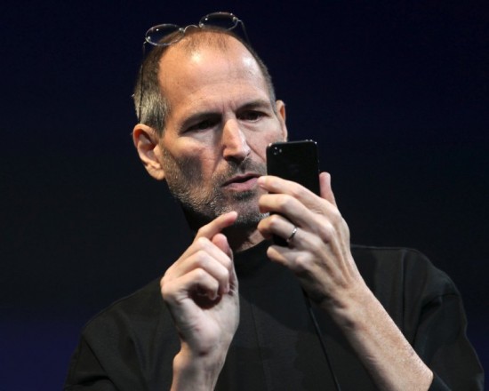 Apple CEO Steve Jobs demonstrates the new iPhone 4 during his appearance at the Apple Worldwide Developers Conference in San Francisco