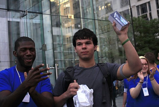 Evan Wiendczak of Boston displays the first iPhone 4 purchased at the Apple Store 5th Avenue in New York