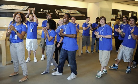 Staff at the Apple store cheer as customers are allowed in for the British launch of the new Apple iPhone 4, London