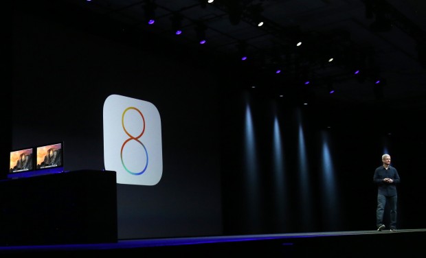 Apple CEO Tim Cook introduces the IOS 8 operating system during his keynote address at the Worldwide Developers Conference in San Francisco, California