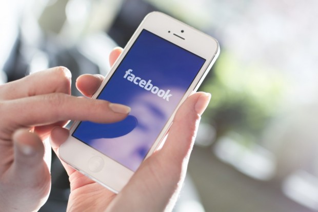 bigstock-Facebook-on-iPhone-60749489-975x650